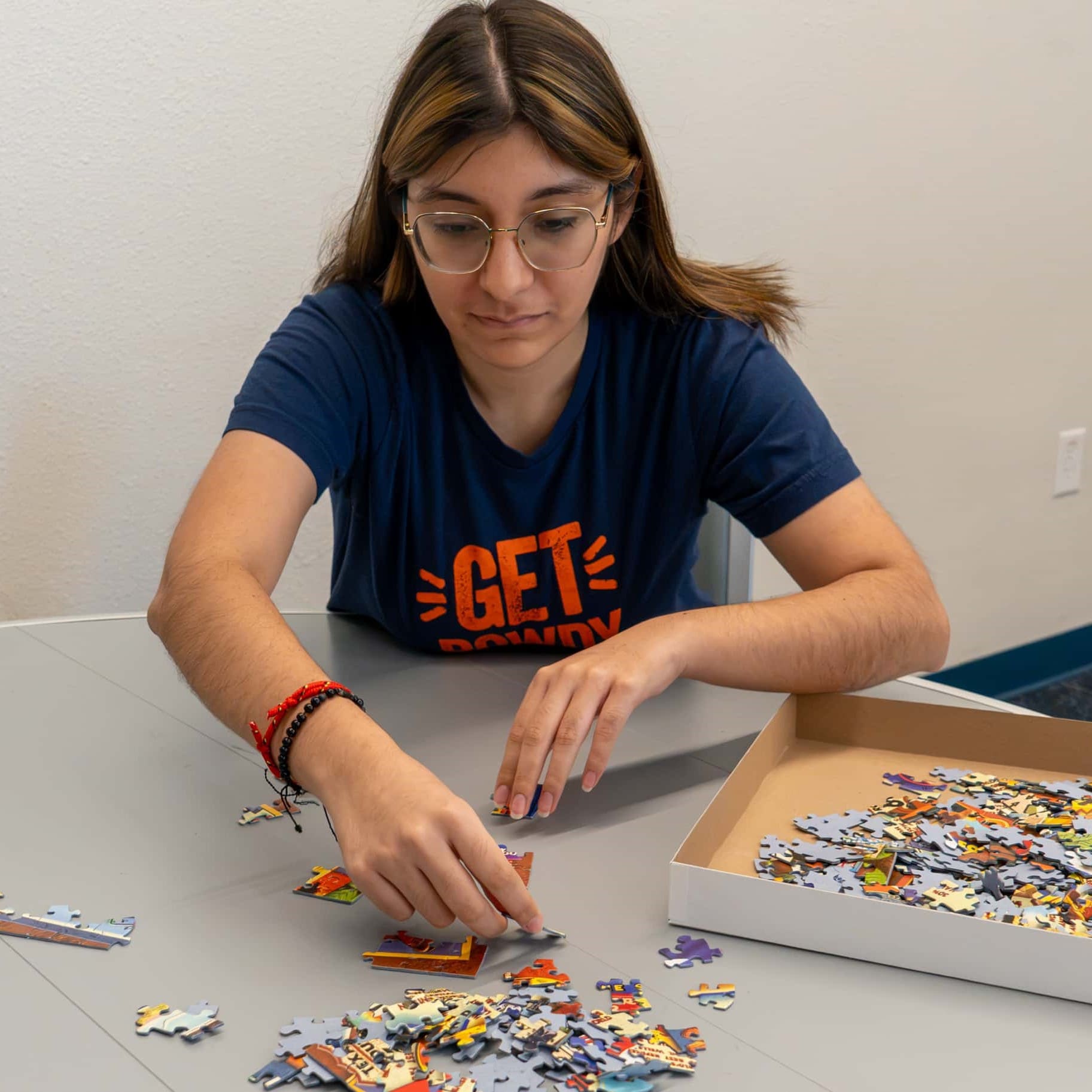 student putting together a puzzle